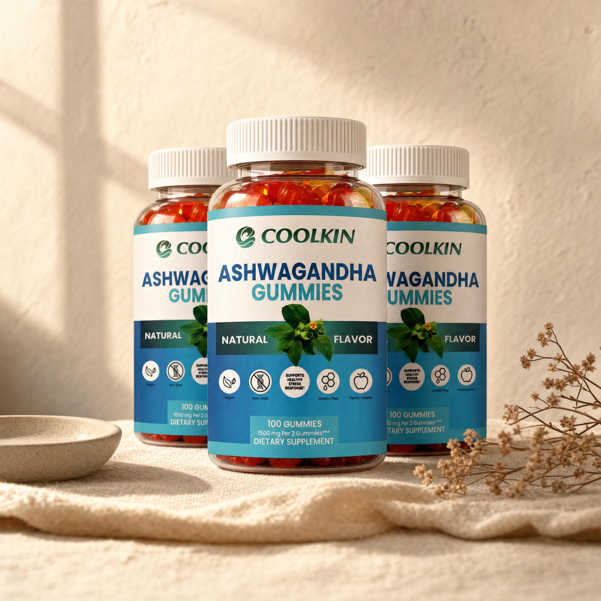 Three bottles of 100 count ashwagandha gummies on cream linen in soft morning light